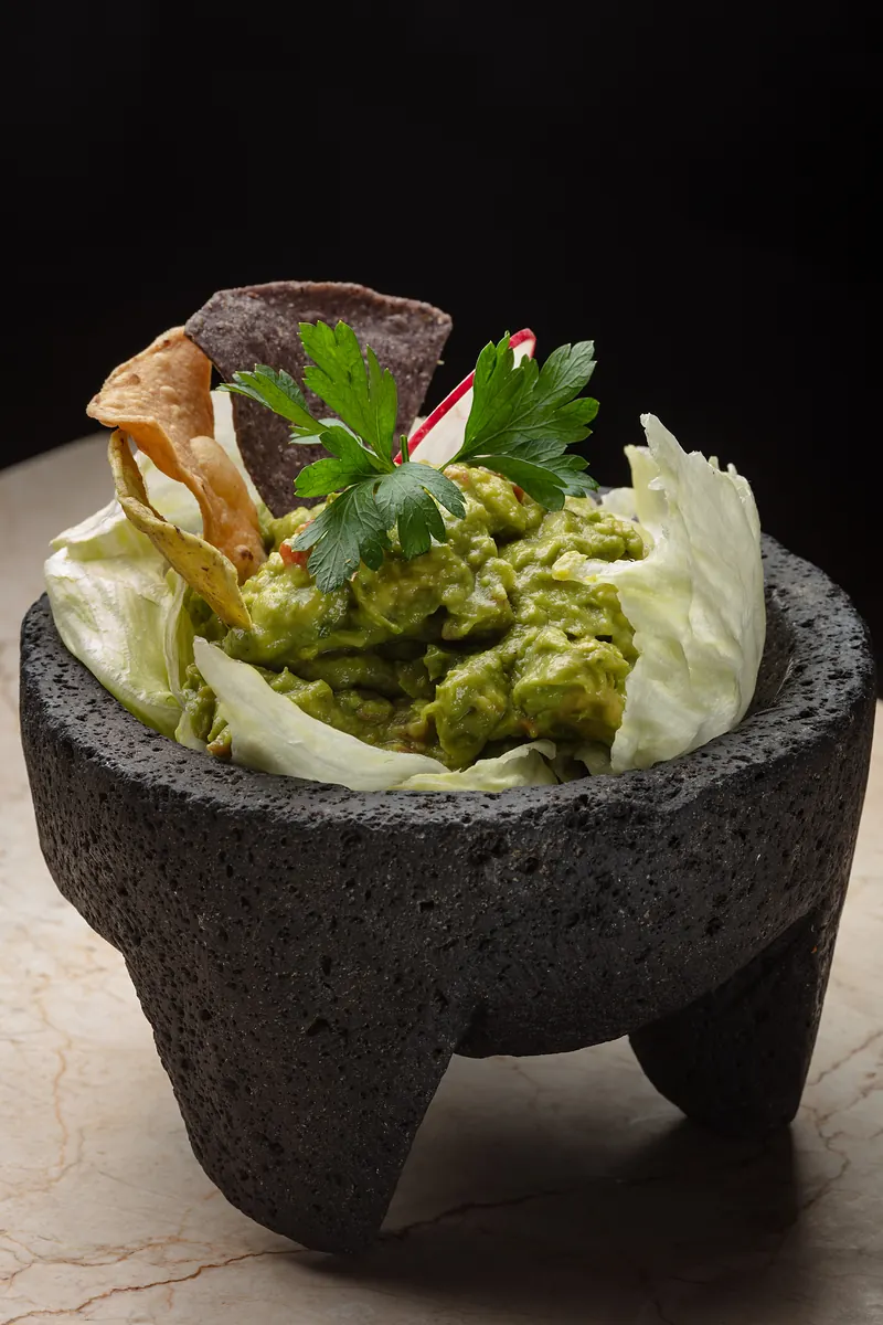 Guacamole served in a stone molcajete