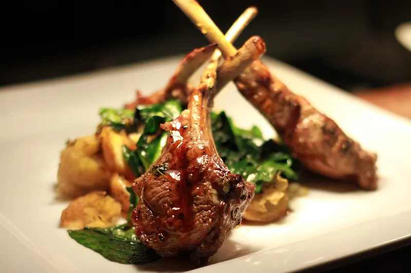 Lamb chops with sautéed greens