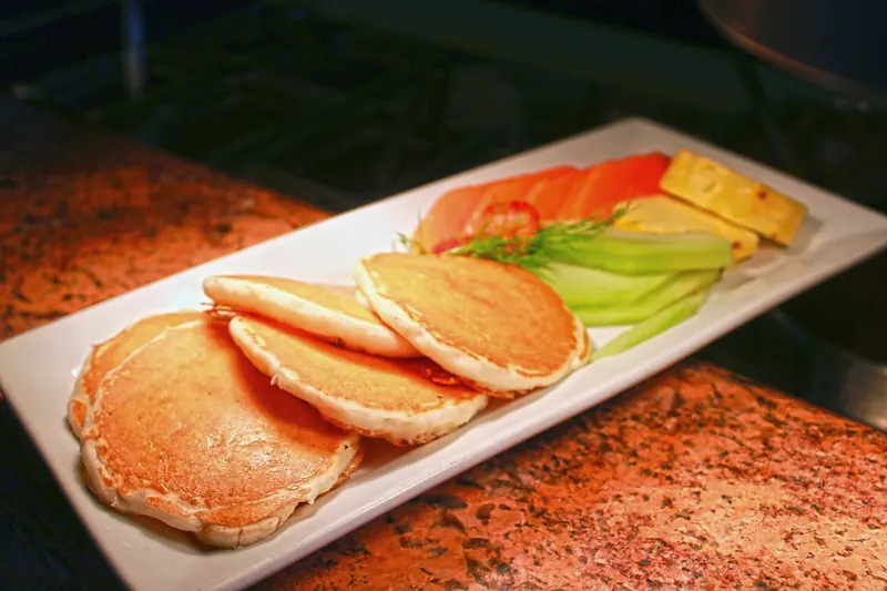 Pancakes served with fresh fruit