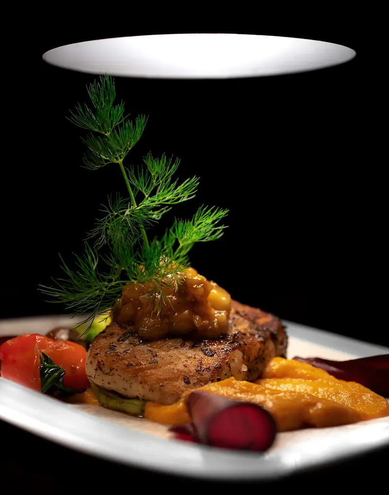 Plated entrée under a pass light